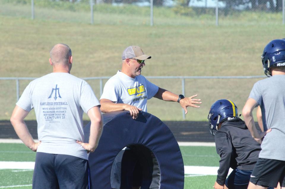Gaylord defensive coordinator Jeff Pretzlaff coaches up an underclassman during a practice on Tuesday, August 8.