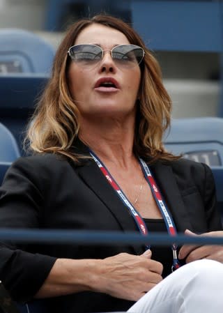 FILE PHOTO: Romanian former gymnast Comaneci attends the women's singles semi-final match between Pennetta of Italy and Halep of Romania at the U.S. Open Championships tennis tournament in New York