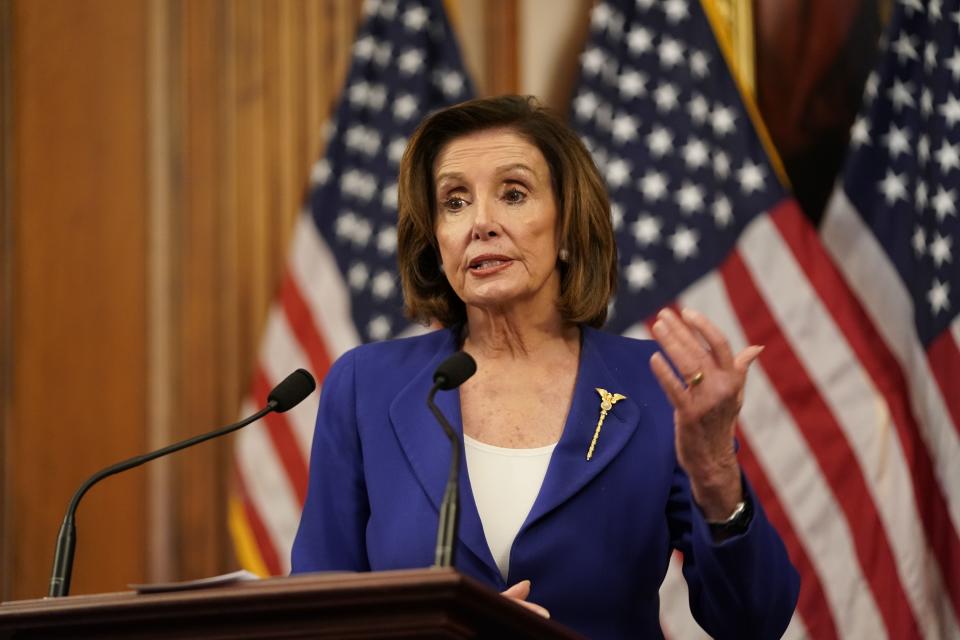 US Speaker of the House Nancy Pelosi speaks to the press after the House passed a $2 trillion stimulus bill, on March 27, 2020, at the US Capitol in Washington, DC. - The House approved by a voice vote a $2.2 trillion rescue package, the largest economic stimulus package in American history, to aid a US economy and health care system battered by the coronavirus pandemic. (Photo by ALEX EDELMAN / AFP) (Photo by ALEX EDELMAN/AFP via Getty Images)