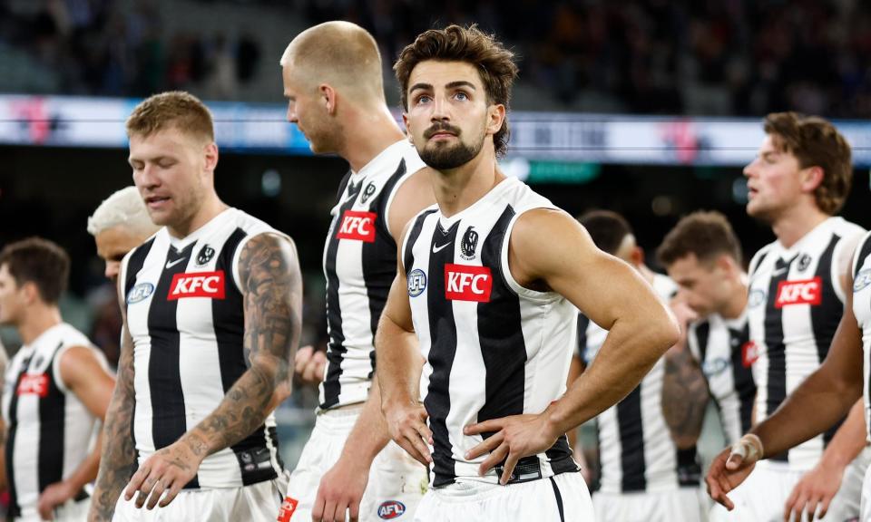 <span>Josh Daicos and his Collingwood teammates after losing to 94-79 to St Kilda Saints at the MGC.</span><span>Photograph: Michael Willson/AFL Photos/Getty Images</span>