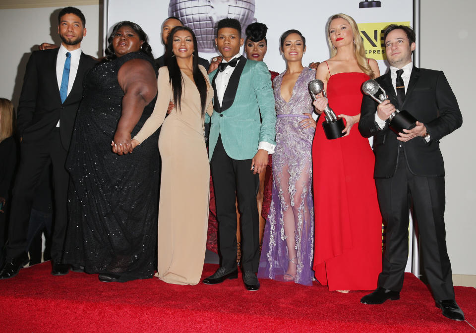 (L-R) Actors Jussie Smollett, Gabourey Sidibe, Trai Byers, Taraji P. Henson, Bryshere Y. Gray aka Yazz, Grace Gealey, Kaitlin Doubleday and Danny Strong pose with the Outstanding Drama Series award for 'Empire.'