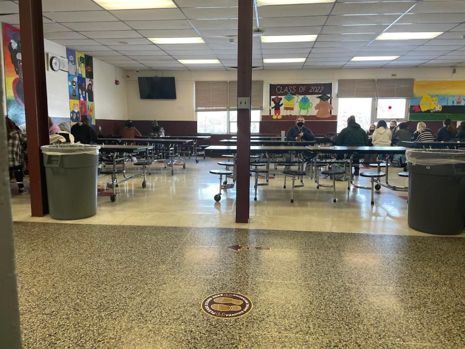 Students are allowed to take their masks down to eat during the study hall period in the cafeteria at Colonie Central High School in Albany, N.Y., student Treva Warzocha says. Many students have been absent because of COVID-19 quarantines, Warzocha says.