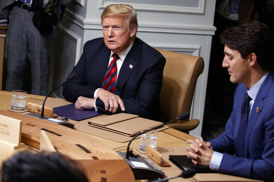 President Donald Trump sits with Canadian Prime Minister Justin Trudeau during a G-7 summit working session, Friday, June 8, 2018, in Charlevoix, Canada. (AP)