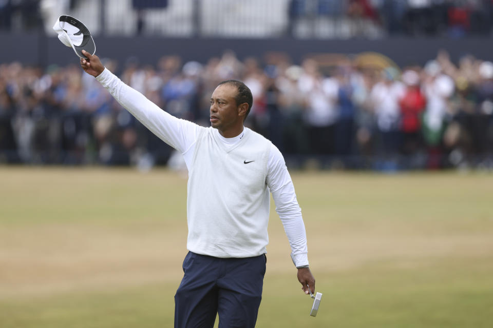 Tiger Woods of the US gestures at the end of his second round of the British Open golf championship on the Old Course at St. Andrews, Scotland, Friday July 15, 2022. The Open Championship returns to the home of golf on July 14-17, 2022, to celebrate the 150th edition of the sport's oldest championship, which dates to 1860 and was first played at St. Andrews in 1873. (AP Photo/Peter Morrison)