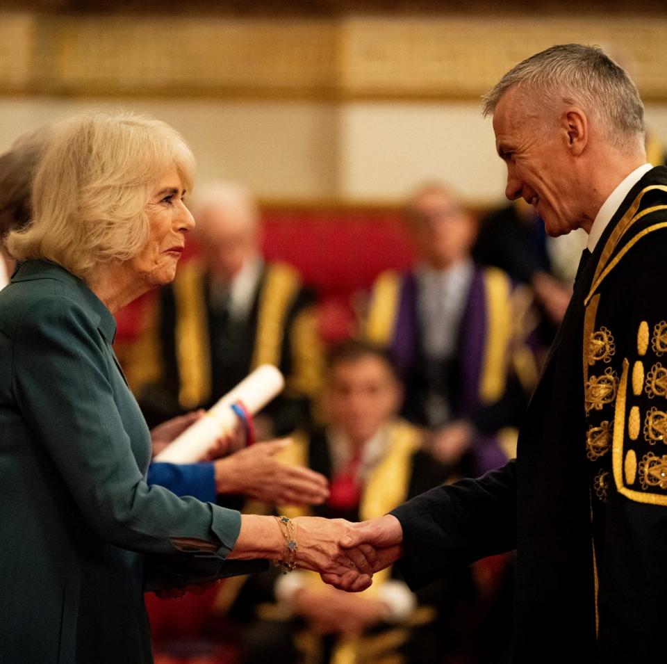 The Queen presents a Queen's Anniversary Prize to a representative from the University of Liverpool