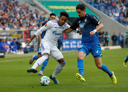 Soccer Football - Bundesliga - TSG 1899 Hoffenheim vs Schalke 04 - Rhein-Neckar-Arena, Hoffenheim, Germany - September 23, 2017 Schalke’s Weston McKennie in action with Hoffenheim’s Benjamin Hubner REUTERS/Michaela Rehle