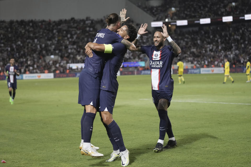 PSG's Sergio Ramos, left, celebrates with his teammates Marquinhos, center, and Neymar after scoring his side's third goal during the French Super Cup final soccer match between Nantes and Paris Saint-Germain at Bloomfield Stadium in Tel Aviv, Israel, Sunday, July 31, 2022. (AP Photo/Ariel Schalit)