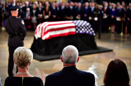 Vice President of the United Staes Mike Pence and his wife Karen Pence view the casket of U.S. Senator John McCain in the Capitol Rotunda where he will lie in state at the U.S. Capitol, in Washington, DC, U.S., August 31, 2018. Kevin Dietsch/Pool via REUTERS