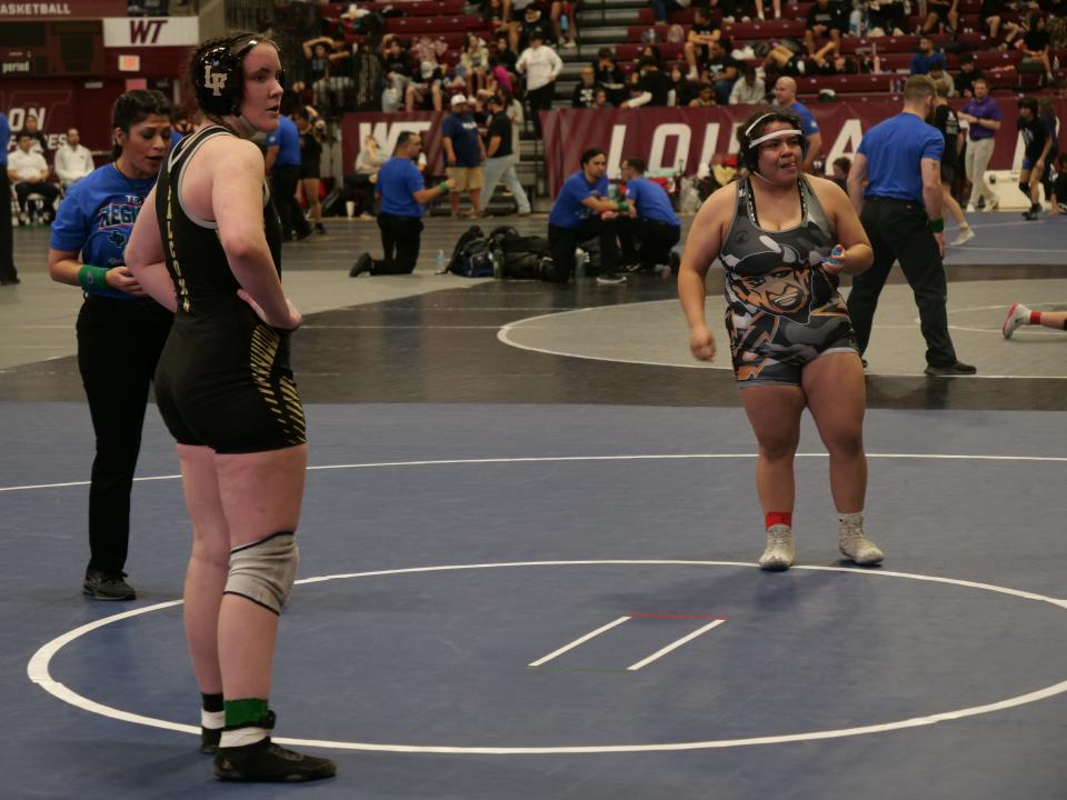 Bushland's Dally McConnell (left) and Dumas' Angel Sanchez (right) prepare to continue their wrestling match during the Region I Wrestling Tournament on Saturday, February 11, 2023 at the First United Bank Center in Canyon.