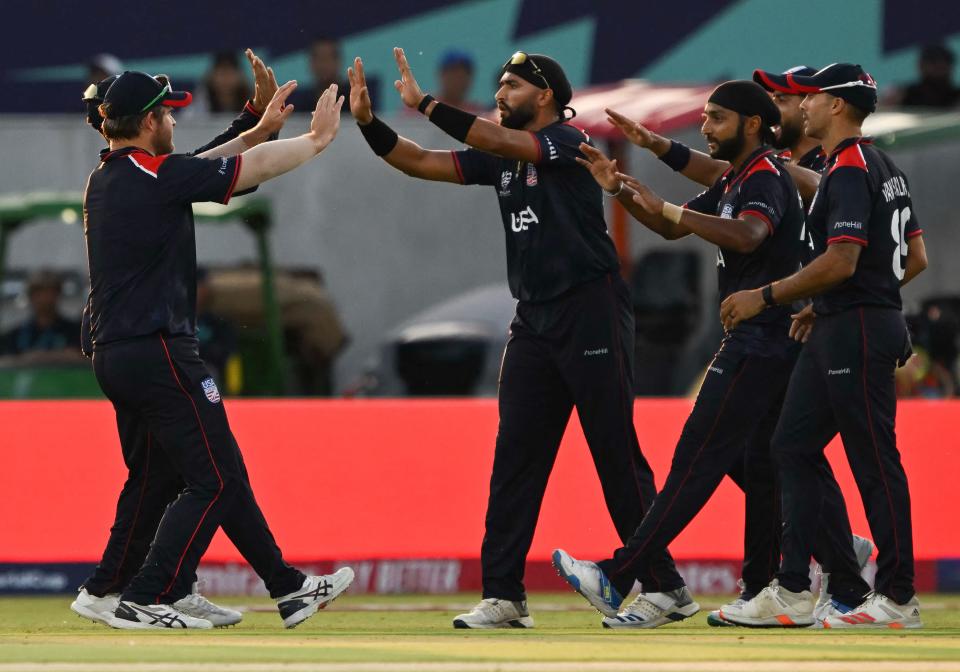 Team USA celebrates catching out Canada's Aaron Johnson during the ICC men's Twenty20 World Cup 2024 cricket match between the USA and Canada at the Grand Prairie Cricket Stadium in Grand Prairie, Texas on June 1, 2024.
