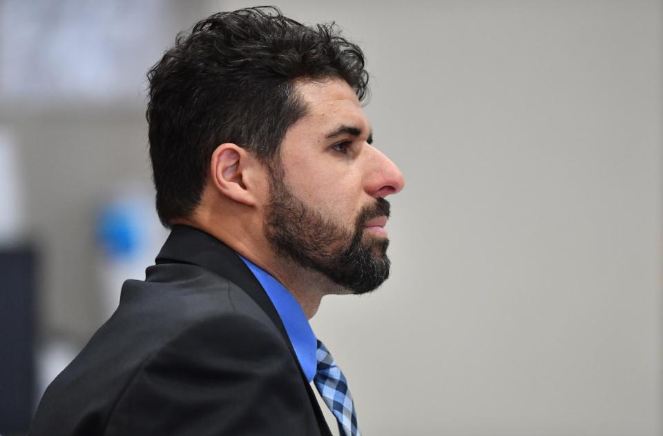 Defense attorney Omar Abdelghany listens to witness testimony Tuesday morning in court. Nyquan Priester has been charged with 2nd degree murder in connection with a shooting at Ackerman Park in December 2021.