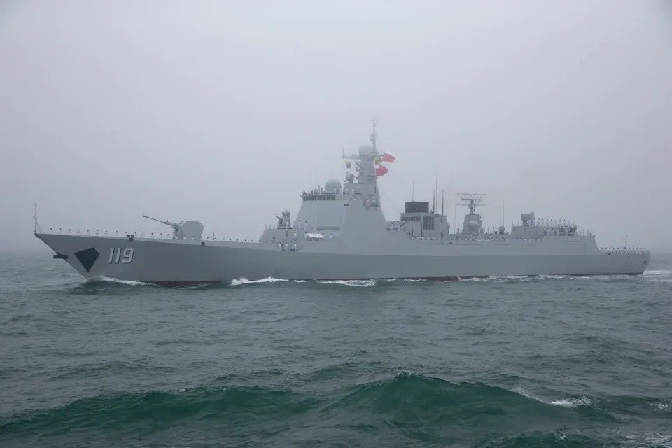 The type 052D guided missile destroyer Guiyang of the Chinese People's Liberation Army  Navy participates in a naval parade to commemorate the 70th anniversary of the founding of China's PLA Navy in the sea near Qingdao, in eastern China's Shandong province in April 2019.