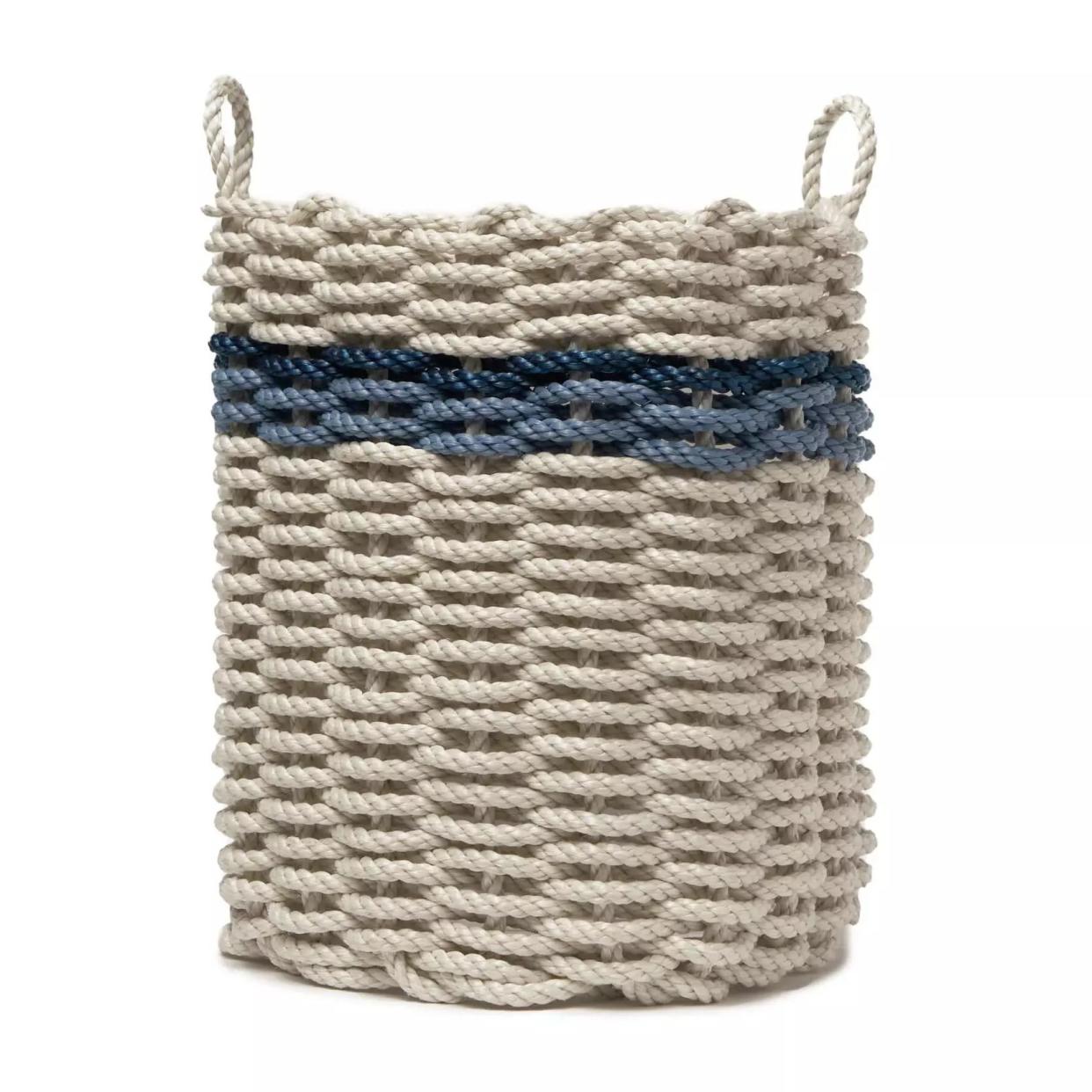 Beige with navy stripe rope basket with handles.