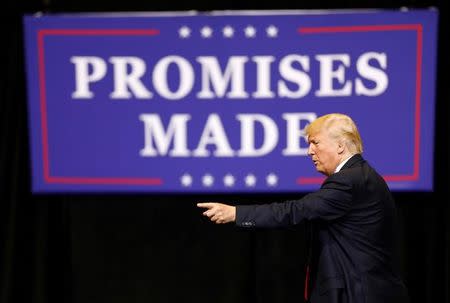 U.S. President Donald Trump waves to the crowd following a rally at the U.S. Cellular Center in Cedar Rapids, Iowa, U.S. June 21, 2017. REUTERS/Scott Morgan