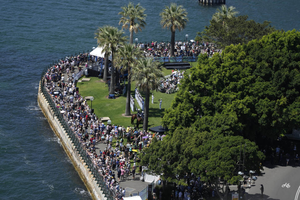 People line the foreshore to watch activities on Sydney Harbour during Australia Day celebration in Sydney, Thursday, Jan. 26, 2023. Australia marks the anniversary of British colonists settling modern day Sydney in 1788 while Indigenous protesters deride Australia Day as Invasion Day. (AP Photo/Rick Rycroft)