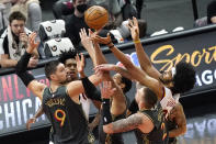 Chicago Bulls center Nikola Vucevic (9), forward Garrett Temple and center Daniel Theis (27) and Cleveland Cavaliers guard Collin Sexton, left, rear, and center Jarrett Allen (31) vie for a rebound during the first half of an NBA basketball game in Chicago, Saturday, April 17, 2021. (AP Photo/Nam Y. Huh)