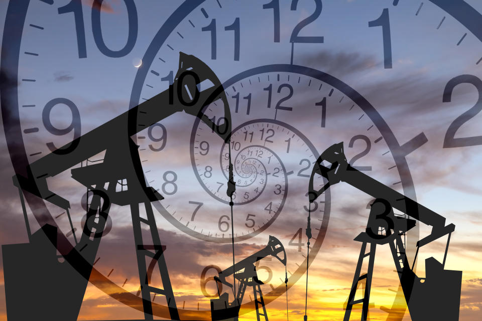 Oil platform on the background of clock