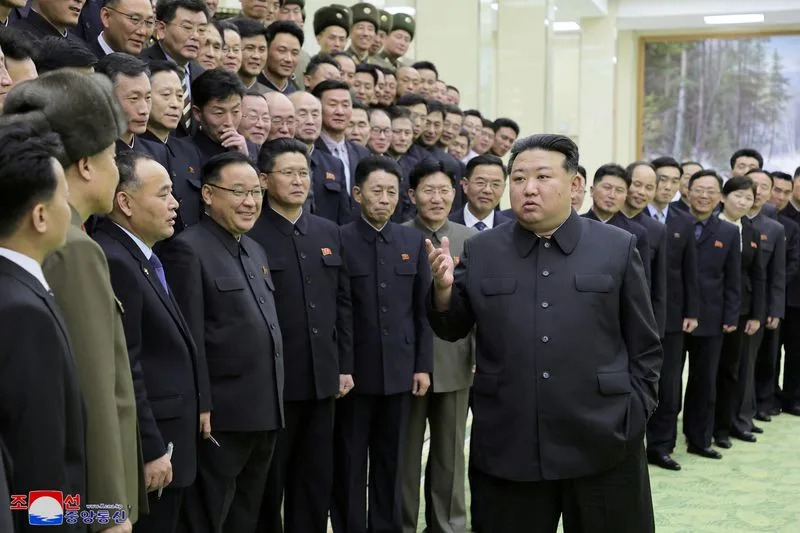 North Korea's leader Kim Jong-un meets with members of the Non-Standing Satellite Launch Preparation Committee