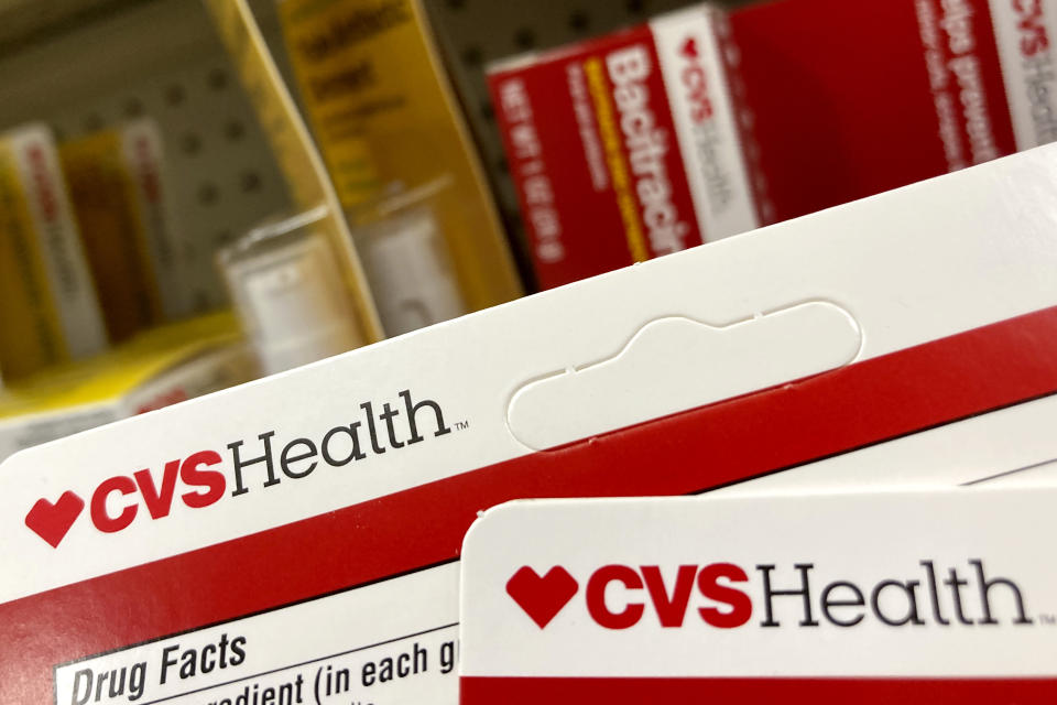 FILE - CVS Health products are displayed at a store, Monday, May 3, 2021, in North Andover, Mass. COVID-19 vaccines and tests for the virus helped push CVS Health past fourth-quarter 2021 expectations. But the drugstore chain and pharmacy benefits manager reaffirmed and did not raise a 2022 forecast it laid out in December, and its shares slid in early-morning trading. (AP Photo/Elise Amendola, File)