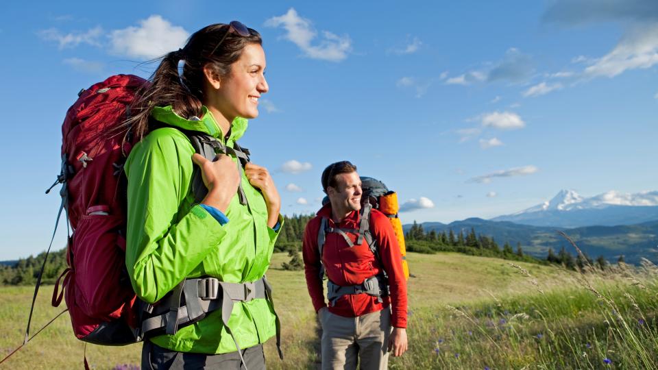 A couple hiking and camping.