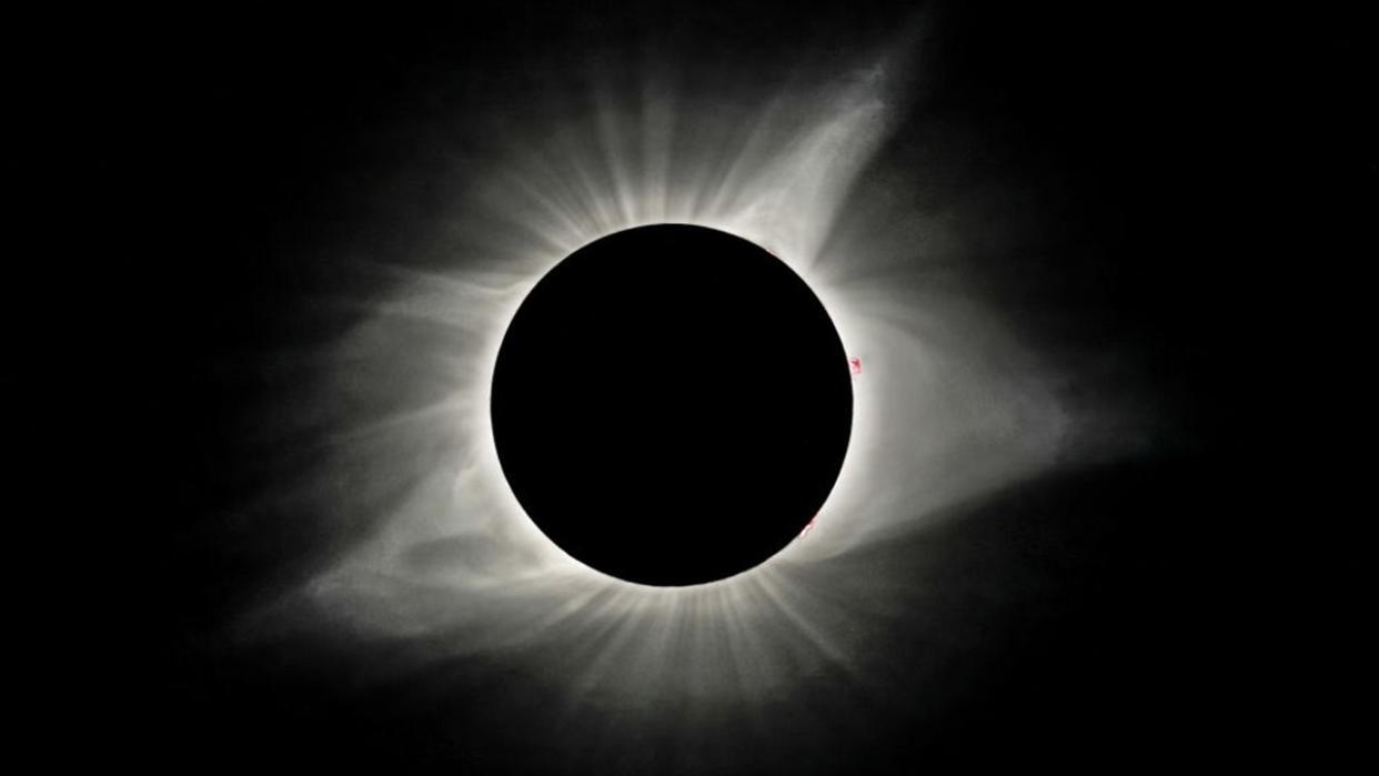 <div>FILE - The sun's corona is visible as the moon obscures the sun during the Great American Solar Eclipse at Madras High School in Madras, Oregon, on Monday, August 21, 2017.</div>