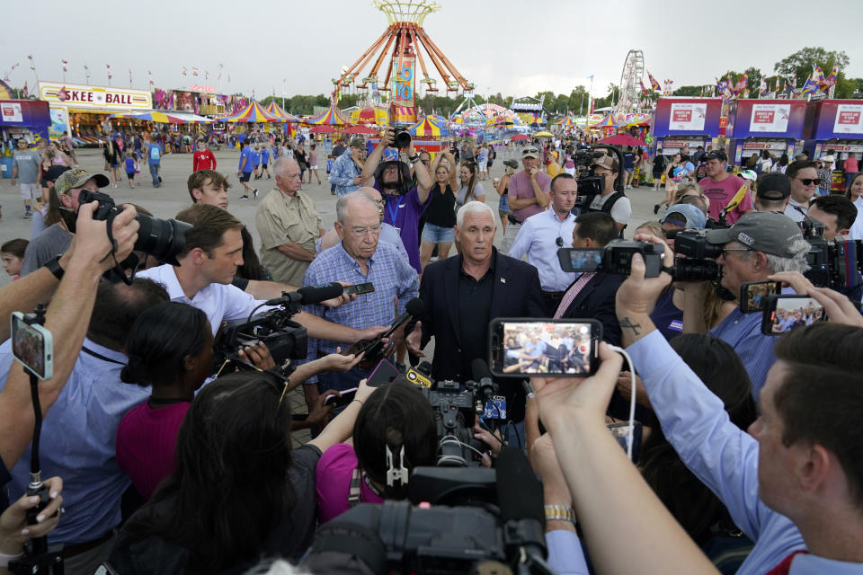 Former Vice President Mike Pence speaks to the media during a visit to the Iowa State Fair, Friday, Aug. 19, 2022, in Des Moines, Iowa. (AP Photo/Charlie Neibergall)