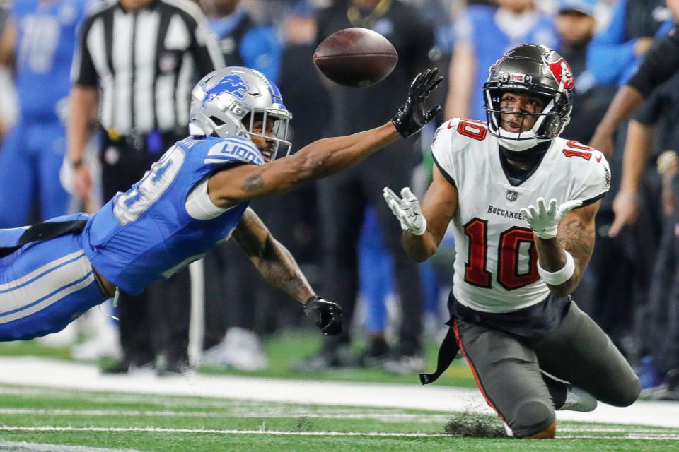 Tampa Bay Buccaneers wide receiver Trey Palmer (10) makes a catch against Detroit Lions cornerback Kindle Vildor (29) during the first half of the NFC divisional round at Ford Field in Detroit on Sunday, Jan. 21, 2024.