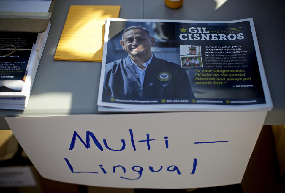 FILE - This Sept. 22, 2018 file photo shows multiple-language campaign literature at a rally in Brea, Calif., for Gil Cisneros, a Democrat running for - and who ultimately won - California's 39th Congressional District seat in Orange County. Orange County's Registrar of Voters reports Wednesday, Aug. 7, 2019, there are 89 more Democrats than Republicans among its 1.6 million registered voters. (AP Photo/Chris Carlson, File)