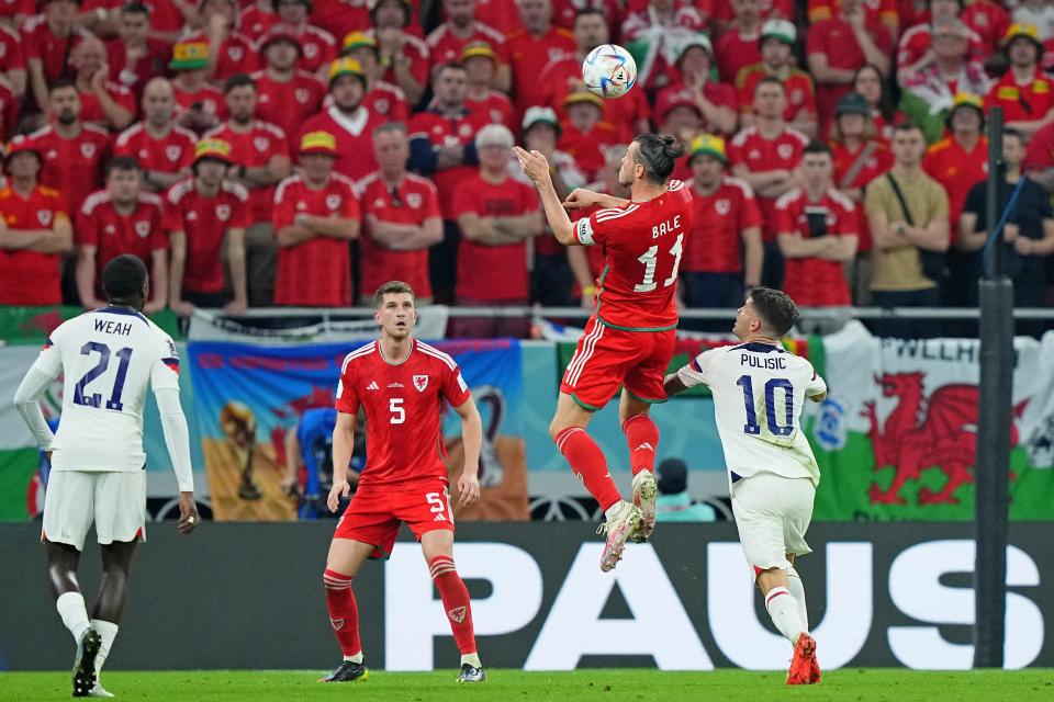 Wales forward Gareth Bale (11) heads the ball against United States forward Christian Pulisic (10) during the first half during of their Group B match during the 2022 FIFA World Cup on Monday, Nov. 21.