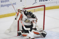 Anaheim Ducks' goalie John Gibson (36) blocks the puck from the net against the Minnesota Wild during the first period of an NHL hockey game Friday, May 7, 2021, in St. Paul, Minn. (AP Photo/Stacy Bengs)