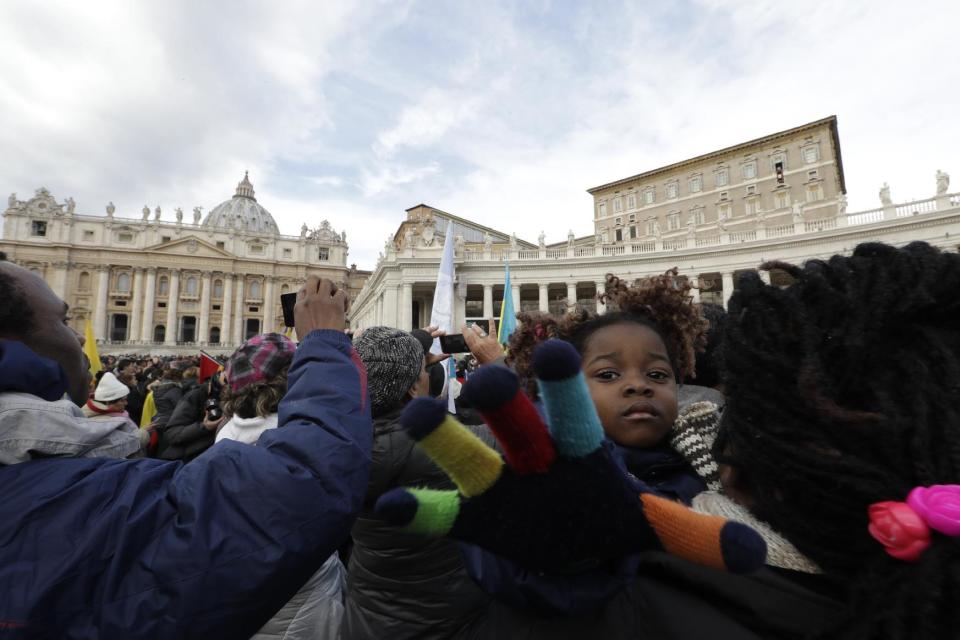 Migrants gather in St. Peter's Square to attend the Angelus noon prayer delivered by Pope Francis at the Vatican, Sunday, Jan.15, 2017. (AP Photo/Andrew Medichini)