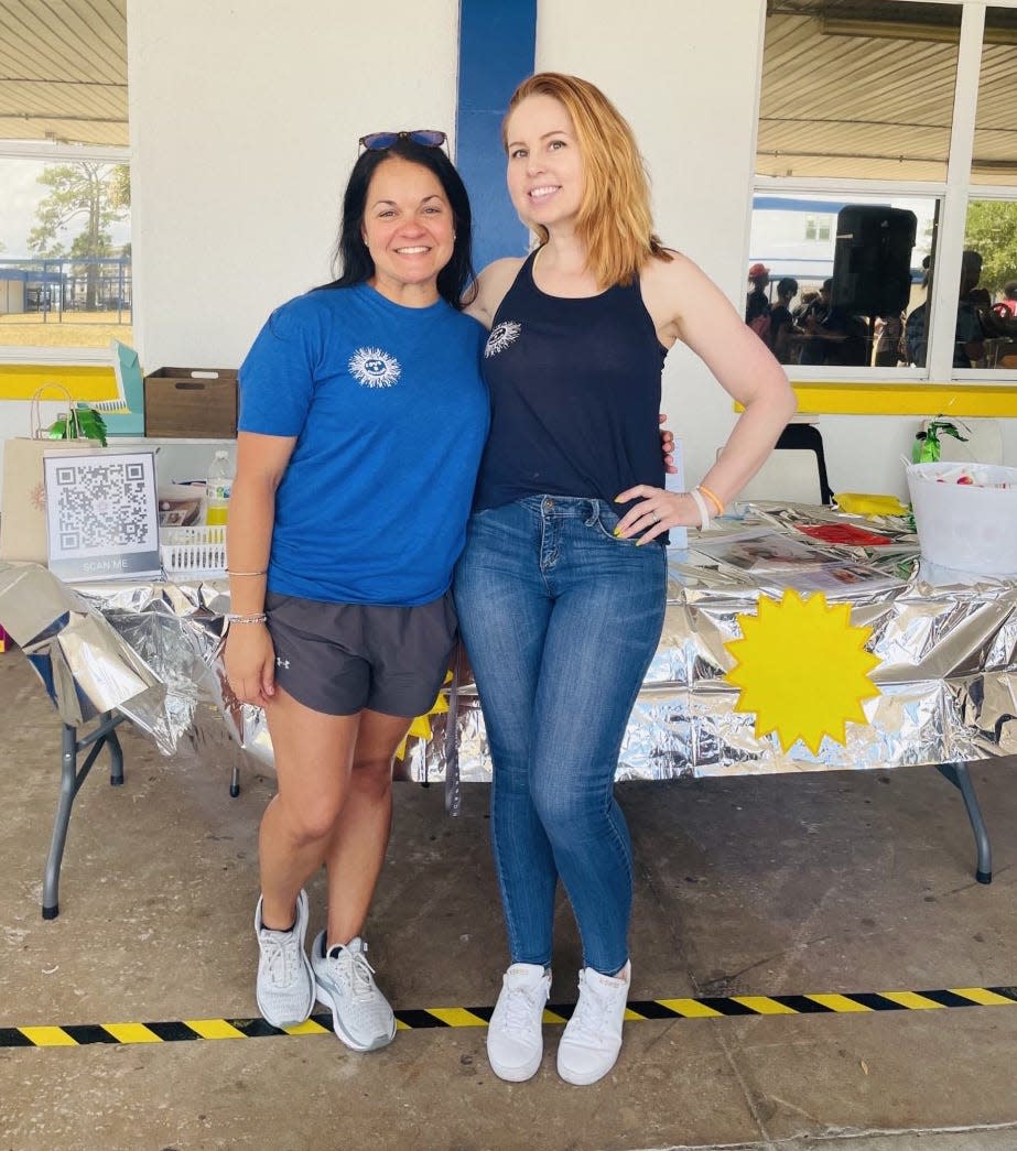 Titusville High teacher Jaqueline Berley, left, and Stage IV cancer survivor Amanda Hunt hold a Love & Sunblock event at the school on Friday, May 13, 2022.