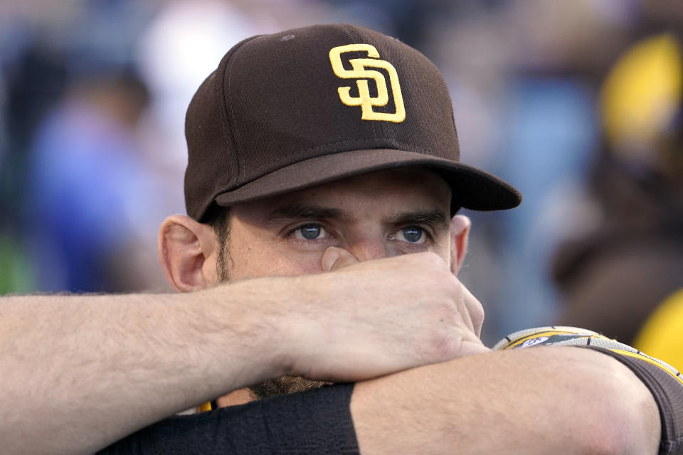 San Diego Padres' Austin Nola watches a video tribute during a ceremony to honor the memory of Los Angeles Dodgers announcer Vin Scully prior to a baseball game between the Dodgers and the San Diego Padres Friday, Aug. 5, 2022, in Los Angeles. Scully, the Hall of Fame broadcaster, whose dulcet tones provided the soundtrack of summer while entertaining and informing Dodgers fans in Brooklyn and Los Angeles for 67 years, died Tuesday night. (AP Photo/Mark J. Terrill)