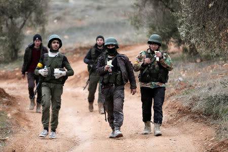 Turkish-backed Free Syrian Army fighters are seen near Mount Barsaya, northeast of Afrin, Syria January 22, 2018. REUTERS/Khalil Ashawi