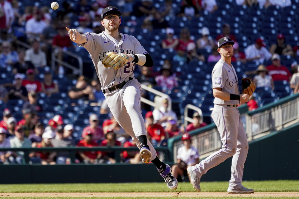 Colorado Rockies shortstop Trevor Story (27) throws to first base during the seventh inning of a baseball game against the Washington Nationals at Nationals Park, Sunday, Sept. 19, 2021, in Washington. (AP Photo/Andrew Harnik)