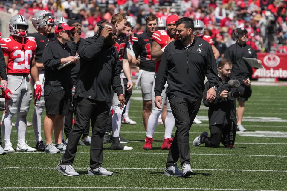 Apr 13, 2024; Columbus, OH, USA; Ohio State Buckeyes head coach Ryan Day interacts with Ohio State Buckeyes running backs coach Carlos Locklyn during the Ohio State football spring game at Ohio Stadium.