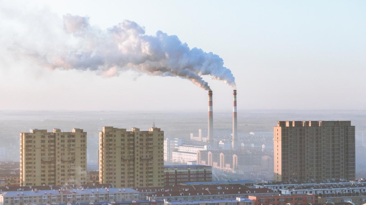 Coal power stations outputting smoke into the air.