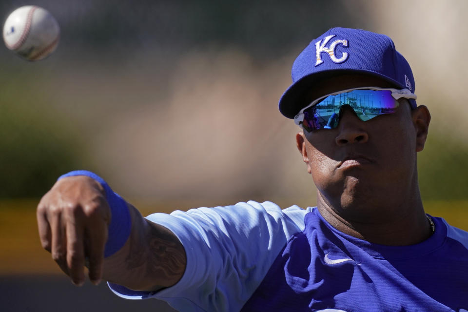 Kansas City Royals catcher Salvador Perez throws during spring training baseball practice Wednesday, Feb. 24, 2021, in Surprise, Ariz. (AP Photo/Charlie Riedel)