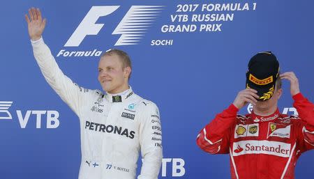 Formula One - F1 - Russian Grand Prix - Sochi, Russia - 30/04/17 - Mercedes Formula One driver Valtteri Bottas of Finland celebrates the victory on the podium. REUTERS/Maxim Shemetov