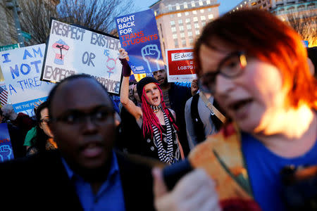 FILE PHOTO - Transgender activists and supporters protest the Trump administration's decision to revoke Obama administration guidance that allowed transgender public school students to use the bathroom of their choice, near the White House in Washington, U.S. on February 22, 2017. REUTERS/Jonathan Ernst/File Photo