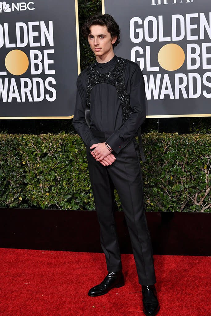 Timothée Chalamet turned heads at the 2019 Golden Globes for turning typical menswear on its head and wearing Virgil Abloh for Louis Vuitton’s embellished harness look. - Credit: Rob Latour/Shutterstock