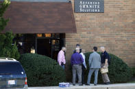 <p>Officials stand outside the scene of a fatal shooting at a business park in the Edgewood area of Harford County, Md., Wednesday, Oct. 18, 2017. The victims and the suspect worked for Advanced Granite Solutions. (Photo: Patrick Semansky/AP) </p>