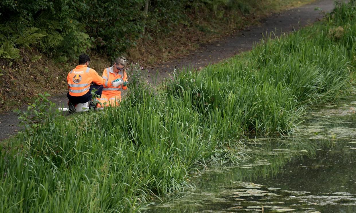 <span>Technicians take water samples from the canal after the pollution incident.</span><span>Photograph: Christopher Furlong/Getty Images</span>