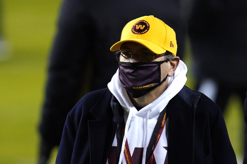 FILE - In this Jan. 9, 2021, file photo, Washington Football Team owner Daniel Snyder walks on the field prior to an NFL wild-card playoff football game against the Tampa Bay Buccaneers in Landover, Md. Twenty female former Washington Football Team employees are calling on NFL Commissioner Roger Goodell to release the final report of an independent investigation into the organization's conduct. The employees and their lawyers sent letters to Goodell on Thursday, Feb. 25, 2021, making the request. Snyder hired Beth Wilkinson to investigate in July after former employees made allegations of workplace sexual harassment. (AP Photo/Julio Cortez, File)