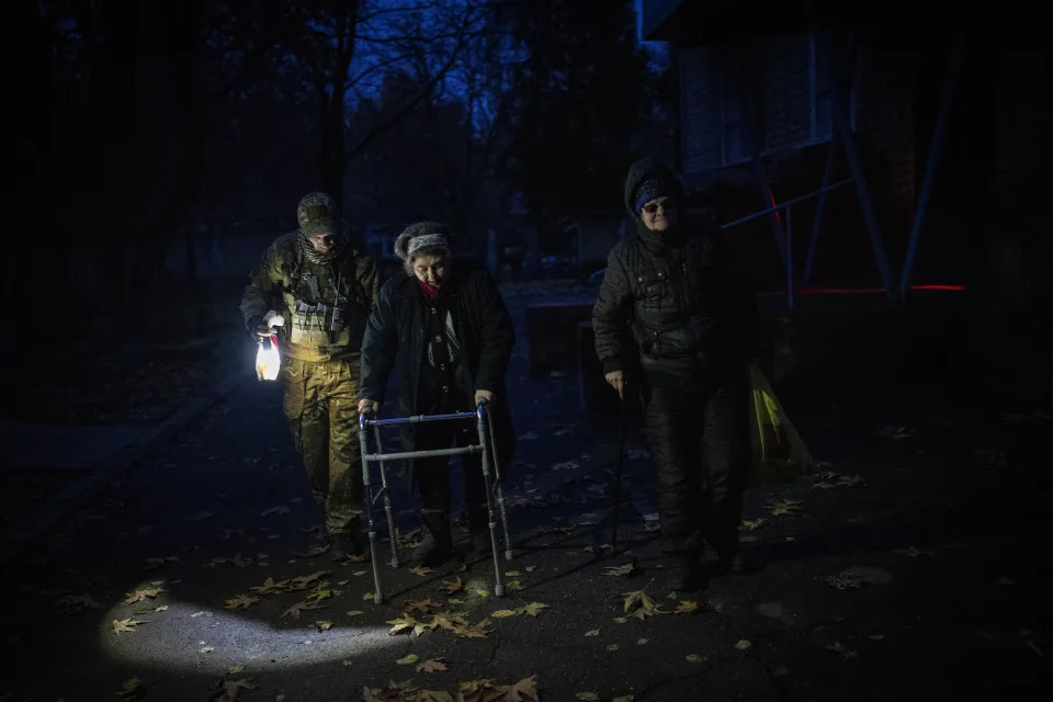 Elderly residents are evacuated from the southern city of Kherson, Ukraine, on Nov. 27. 