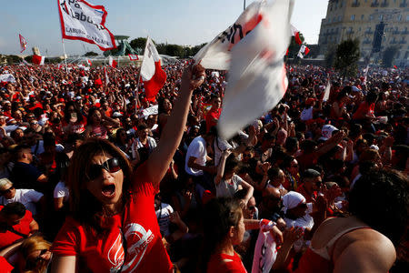 Labour Party supporters celebrate during a May Day rally, after Prime Minister Joseph Muscat urged supporters to attend as a response to the revelations made by the Daphne Project, according to local media, in Valletta, Malta May 1, 2018. REUTERS/Darrin Zammit Lupi
