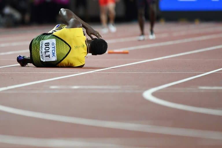 Jamaica's Usain Bolt goes down after pulling up injured in the final of the men's 4x100m relay at the 2017 IAAF World Championships at the London Stadium in London on August 12, 2017