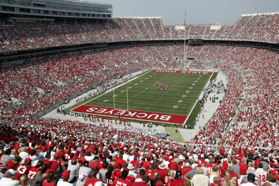 FILE - In this Sept. 3, 2011, file photo, fans fill Ohio Stadium as Ohio State takes on Akron in the second half of an NCAA college football game in Columbus, Ohio. Ohio State will limit home crowds to about 20,000 and prohibit tailgating if the football season is played this fall. Fans inside Ohio Stadium will be required to wear masks and observe social distancing to help stem the spread of the coronavirus pandemic. (AP Photo/Amy Sancetta, File)