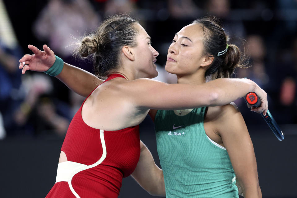 Aryna Sabalenka, left, of Belarus is congratulated by Zheng Qinwen of China following the women's singles final at the Australian Open tennis championships at Melbourne Park, Melbourne, Australia, Saturday, Jan. 27, 2024. (AP Photo/Asanka Brendon Ratnayake)