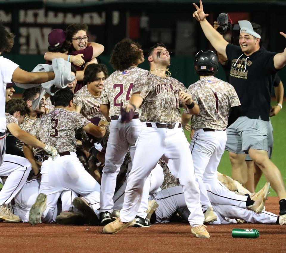 Iona Prep players celebrate after beating Monsignor Farrell 3-2 to win the CHSAA city championship at St. Johns June 10, 2022. 